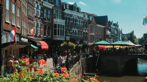 Canal houses and waterside terraces along the Oudegracht in Utrecht on a sunny day