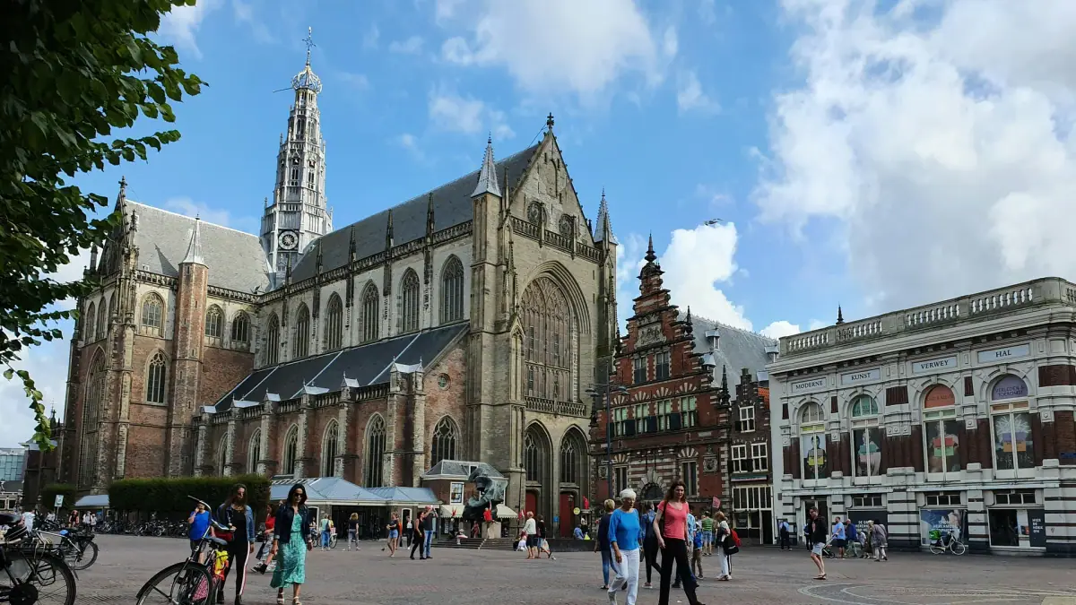 The Grote or St. Bavokerk and historic buildings on Haarlem's Grote Markt in daylight